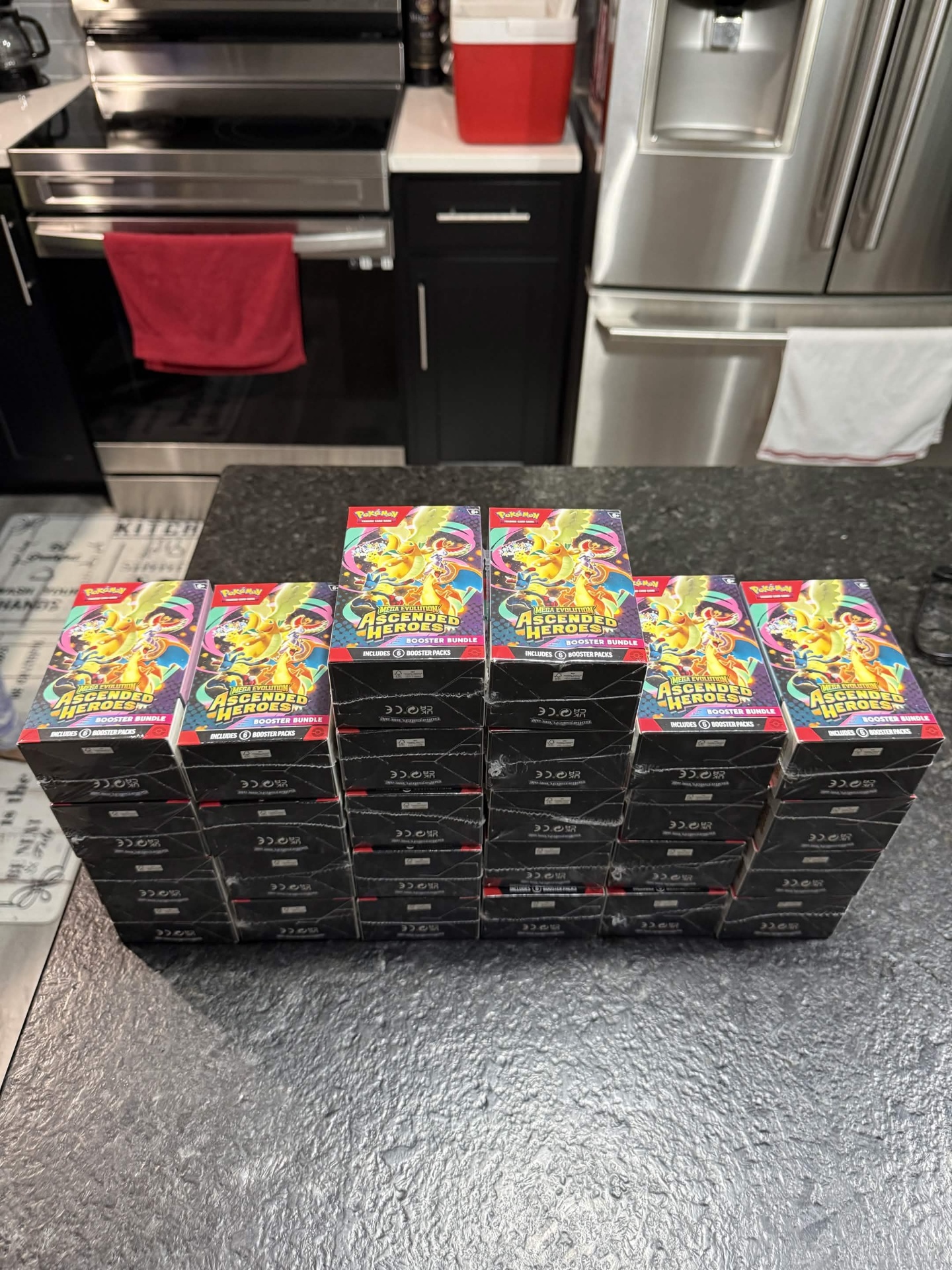 Rows of Mega Evolution Ascended Heroes Booster Bundles stacked on counter