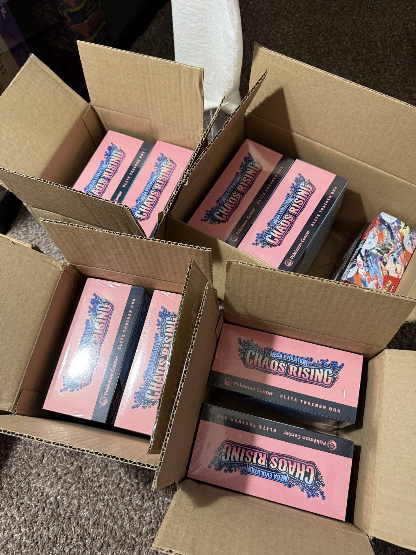 Multiple boxes of Chaos Rising ETBs fresh out of cases