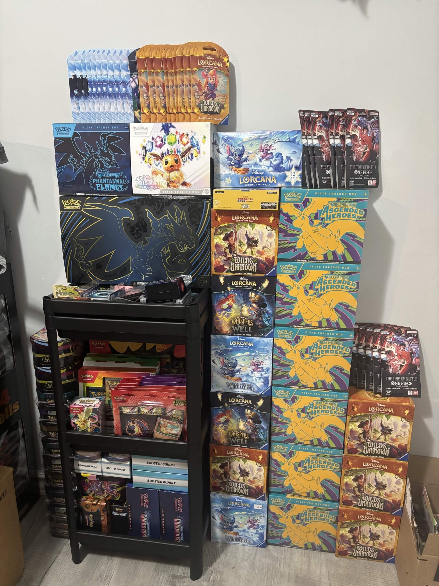 Wall of sealed Pokemon and Lorcana product