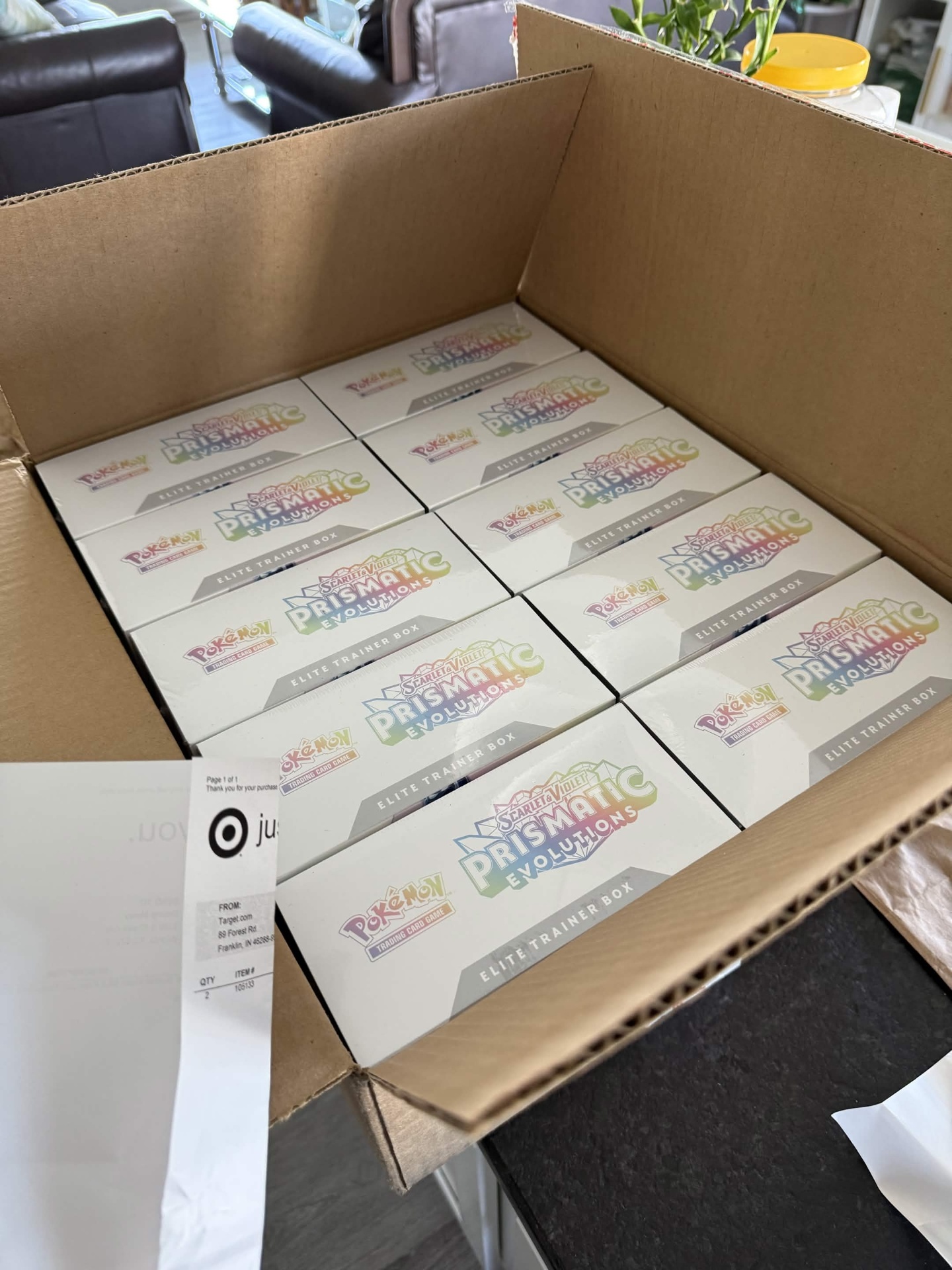 Open case of Prismatic Evolutions Elite Trainer Boxes from Target