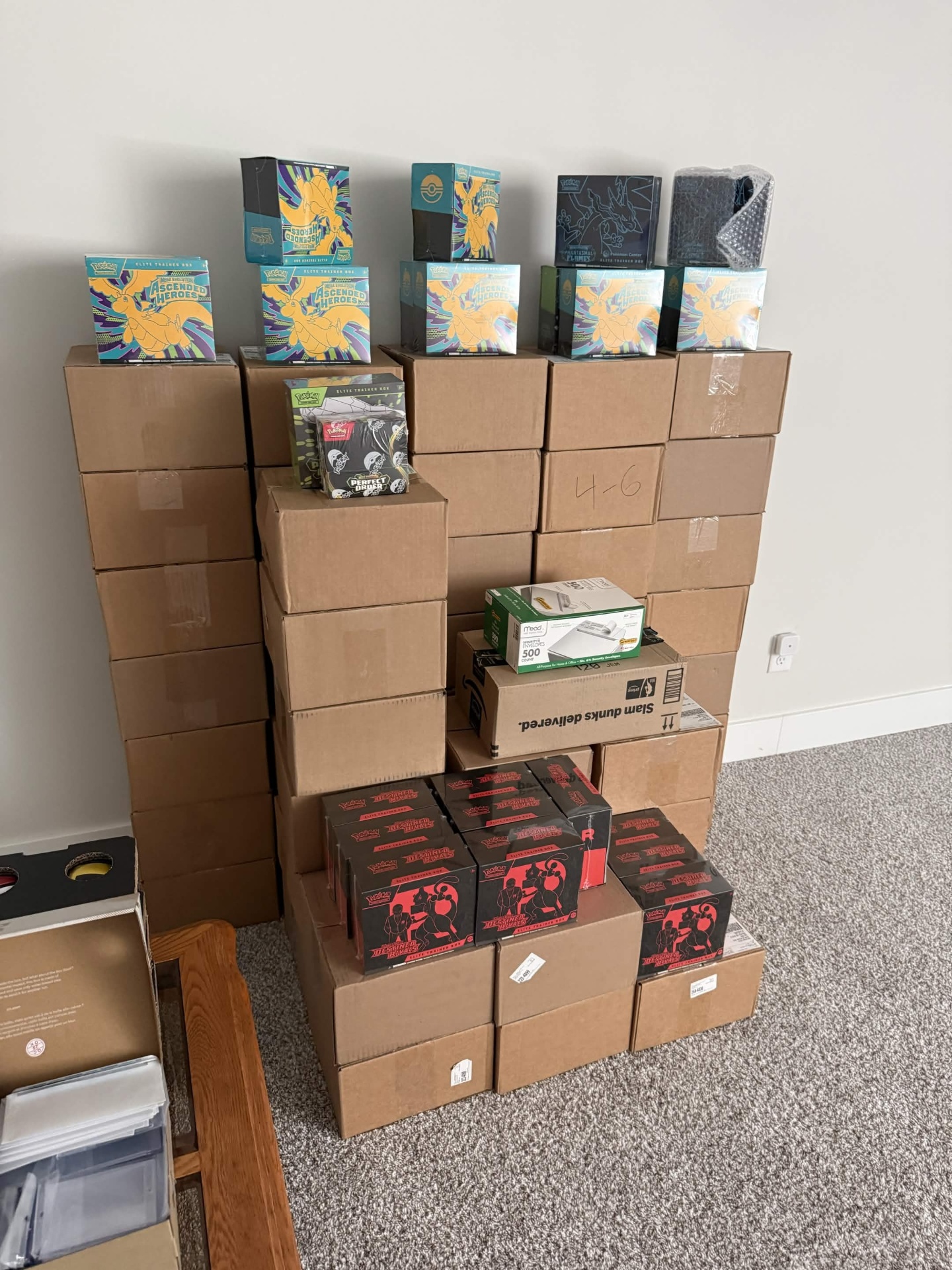 Room stacked with cases of Ascended Heroes and Destined Rivals ETBs